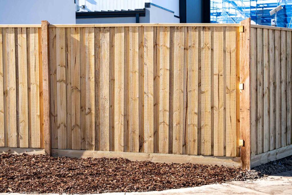 New timber boundary fence installed at the side of a residential property in a suburban development area