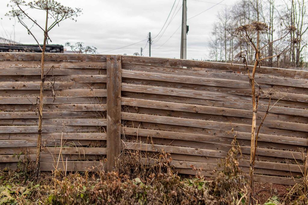 A rickety wooden fence.